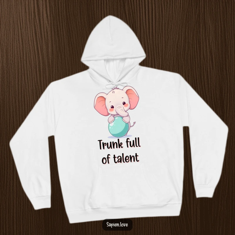 Funny Elephant Hoodie showcasing a smiling elephant character balancing a ball, offering warmth and gentle humor.